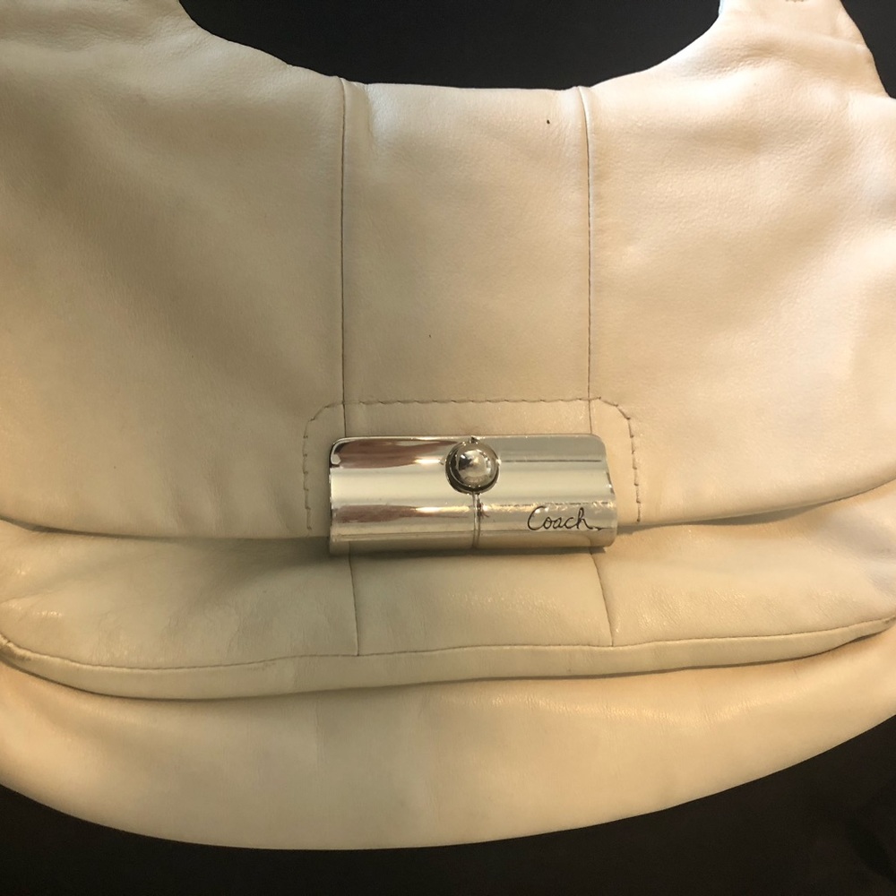 Coach leather purse, off white, front pocket.
